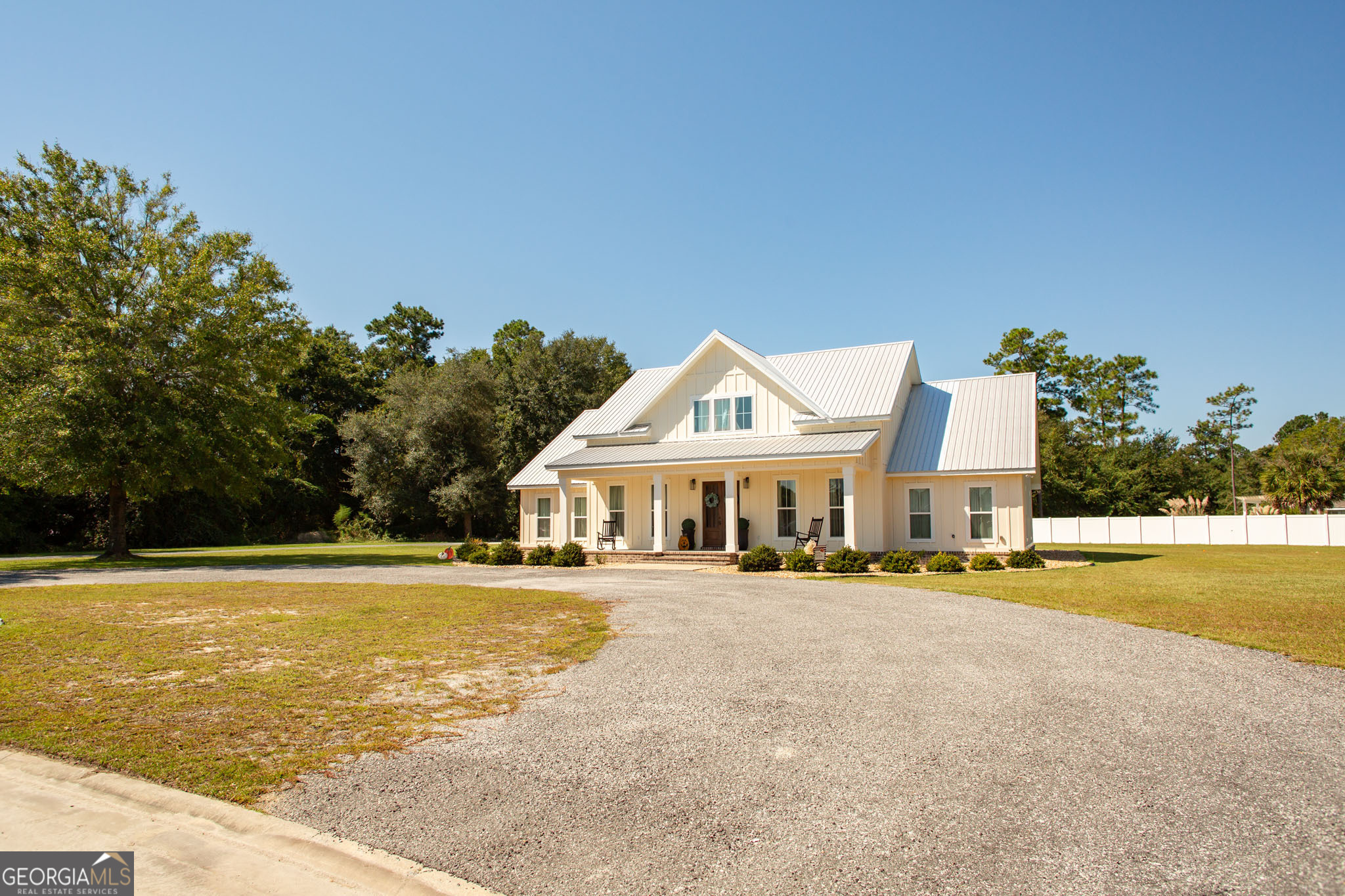 664 Saddle Circle Waycross, GA 31503 - Photo 2 of 39 a view of a house with a swimming pool