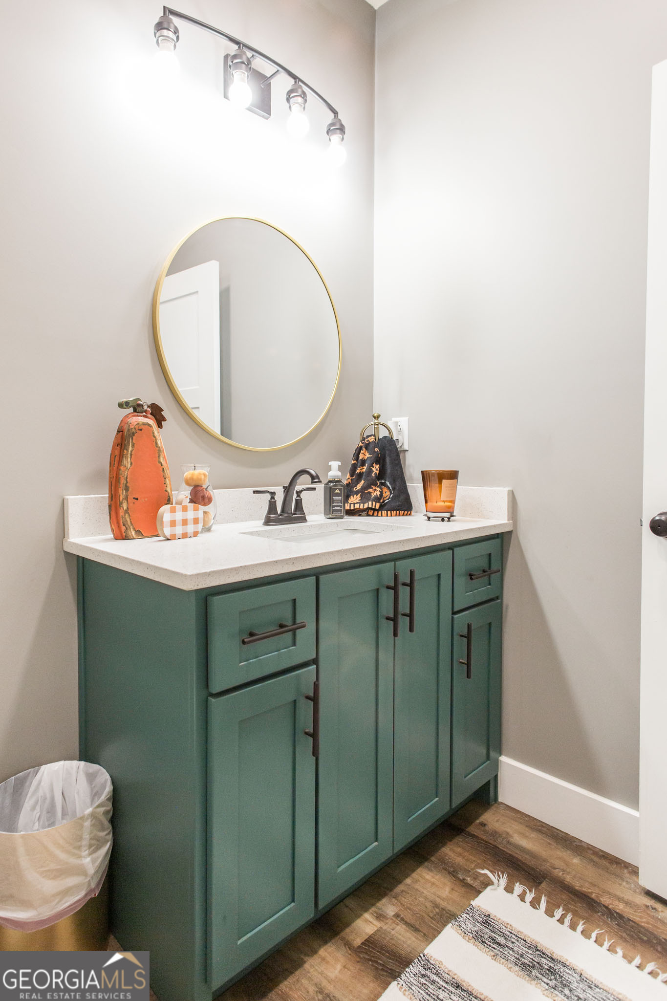 664 Saddle Circle Waycross, GA 31503 - Photo 24 of 39 a bathroom with a sink mirror and toilet