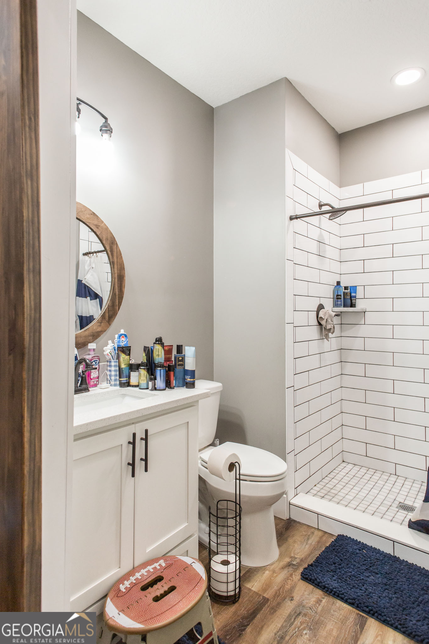 664 Saddle Circle Waycross, GA 31503 - Photo 26 of 39 a bathroom with a sink a toilet and shower curtain