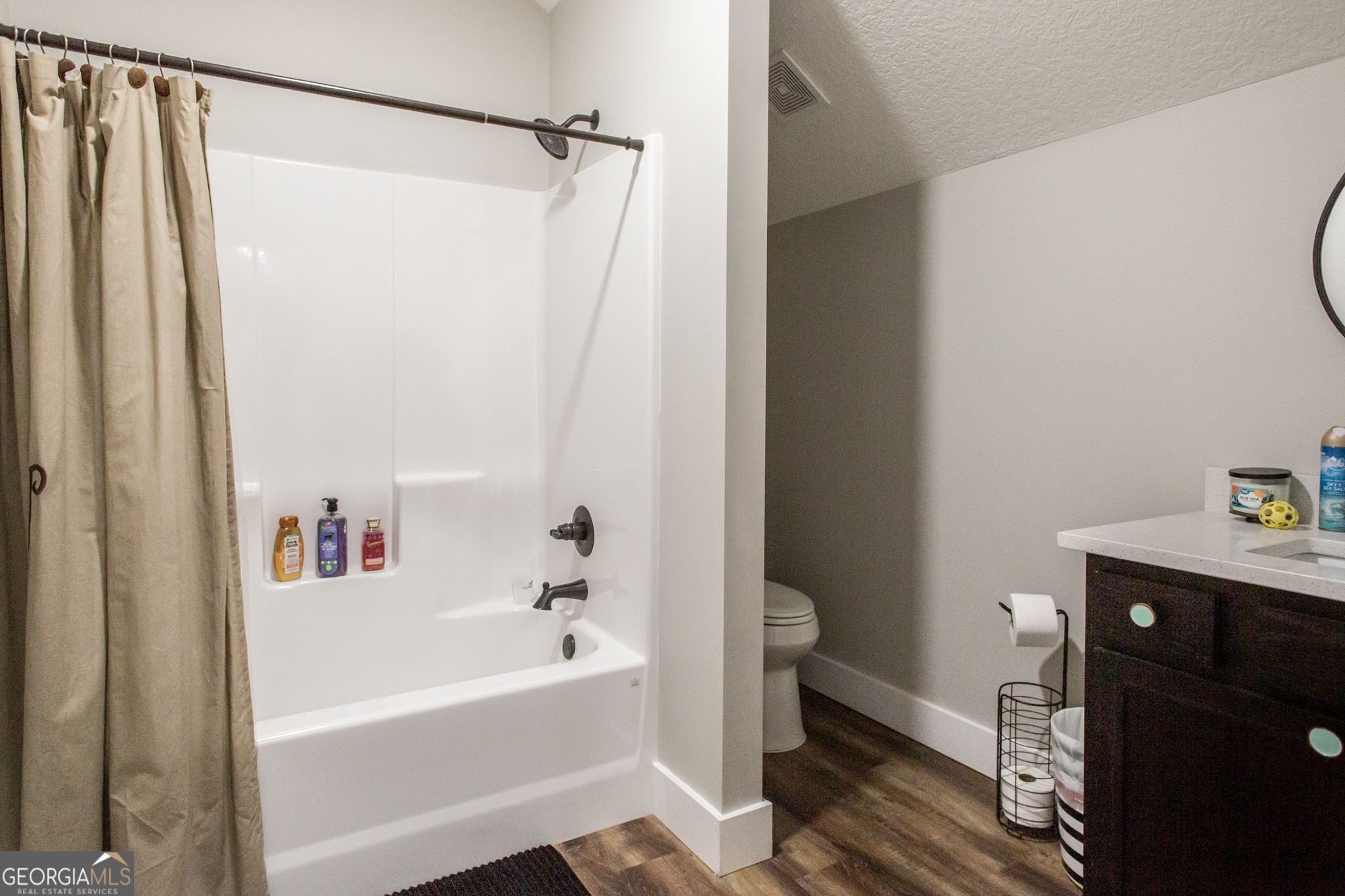 664 Saddle Circle Waycross, GA 31503 - Photo 30 of 39 a bathroom with a bathtub a sink and a shower