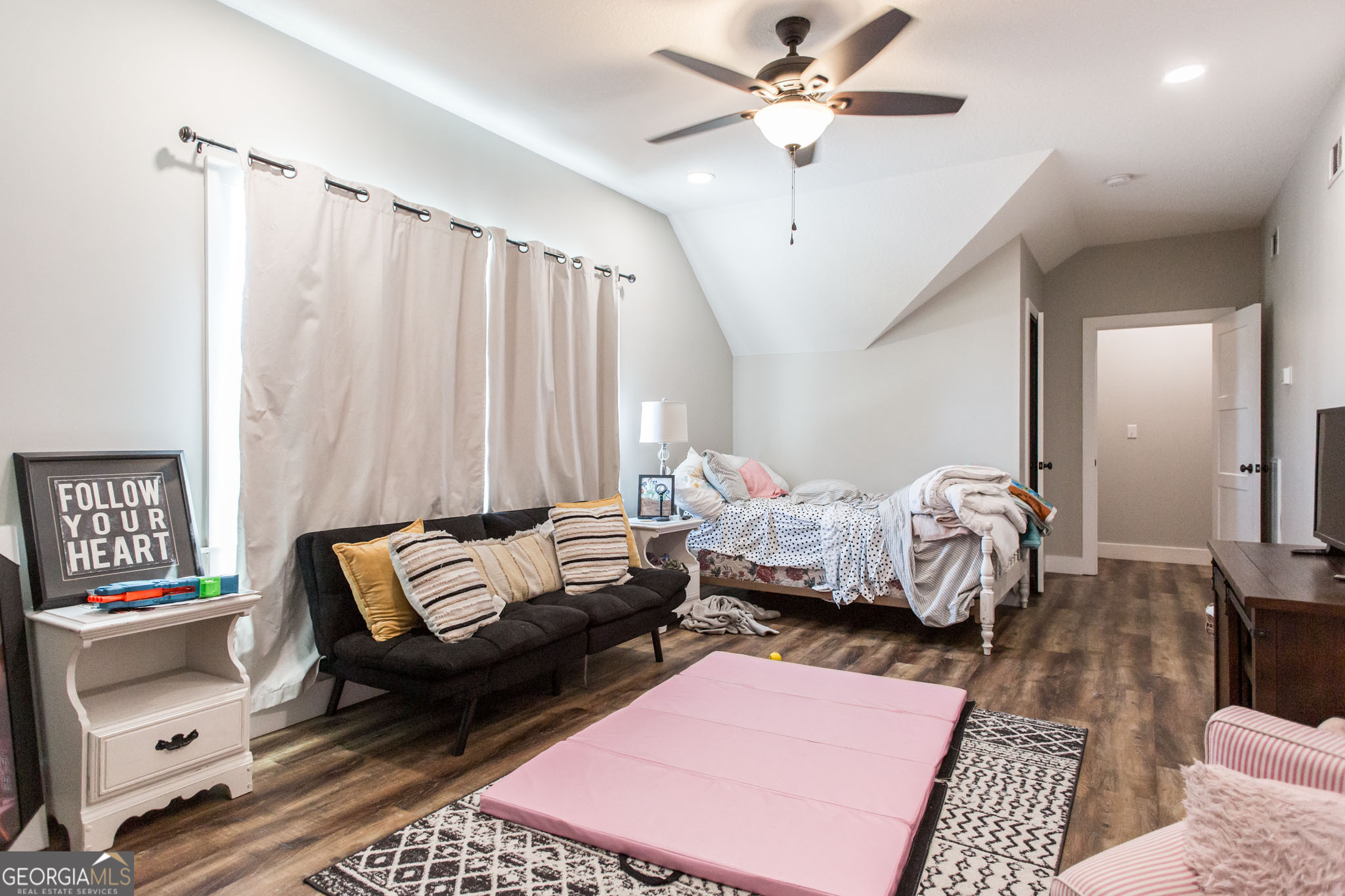 664 Saddle Circle Waycross, GA 31503 - Photo 31 of 39 a bedroom with a bed and a couch