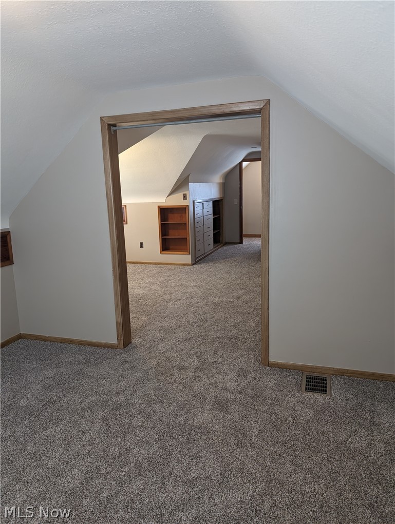 30213 Barjode Road Willowick, OH 44095 - Photo 19 of 20 Additional living space featuring carpet flooring and lofted ceiling