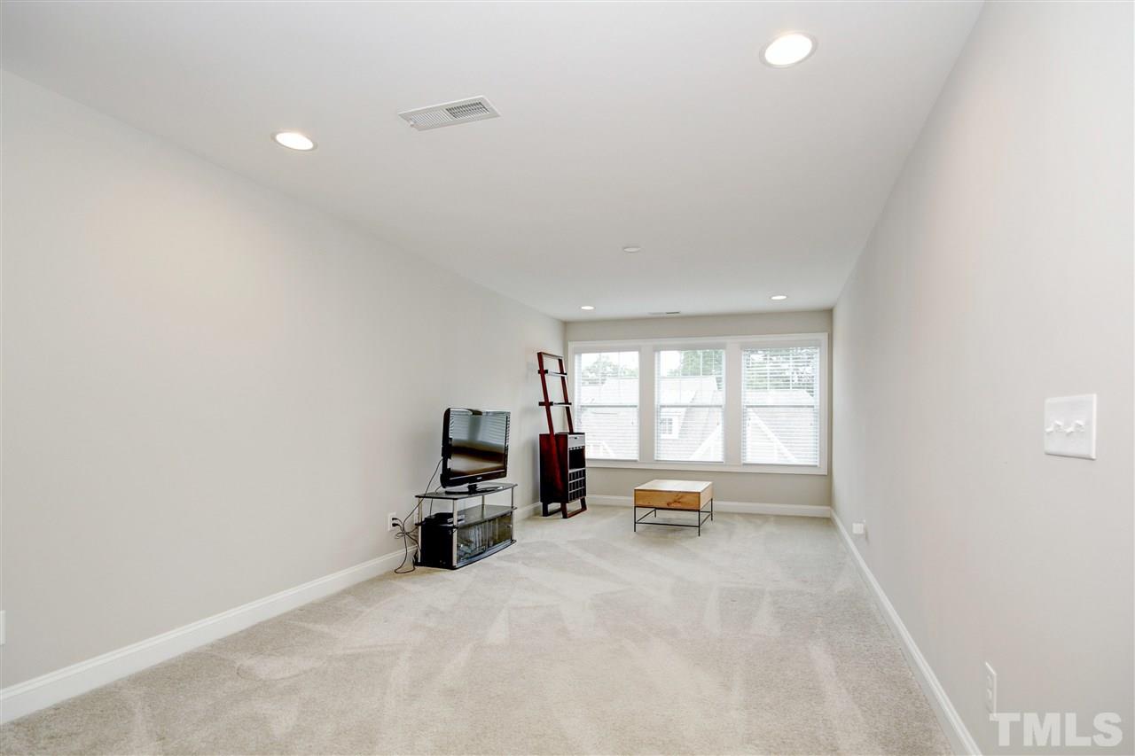 788 Fallon Grove Way Raleigh, NC 27608 - Photo 22 of 30 a view of a livingroom with lounge chair and a window