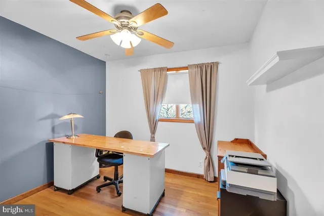 a workspace with furniture and window