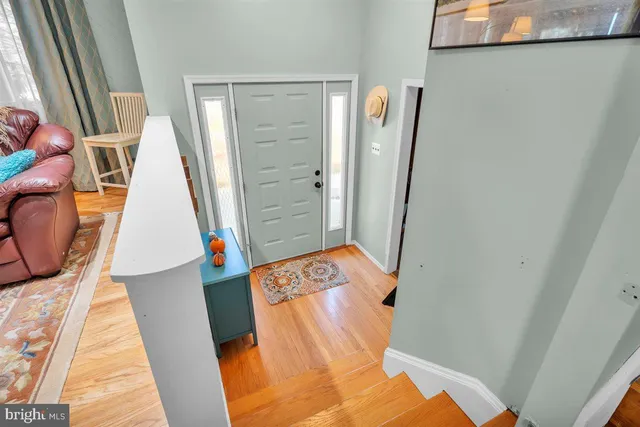 a view of walk in closet with clothes