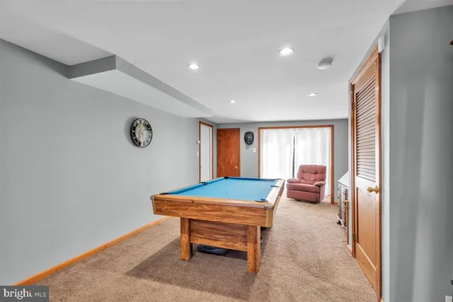 a room with furniture and air hockey table