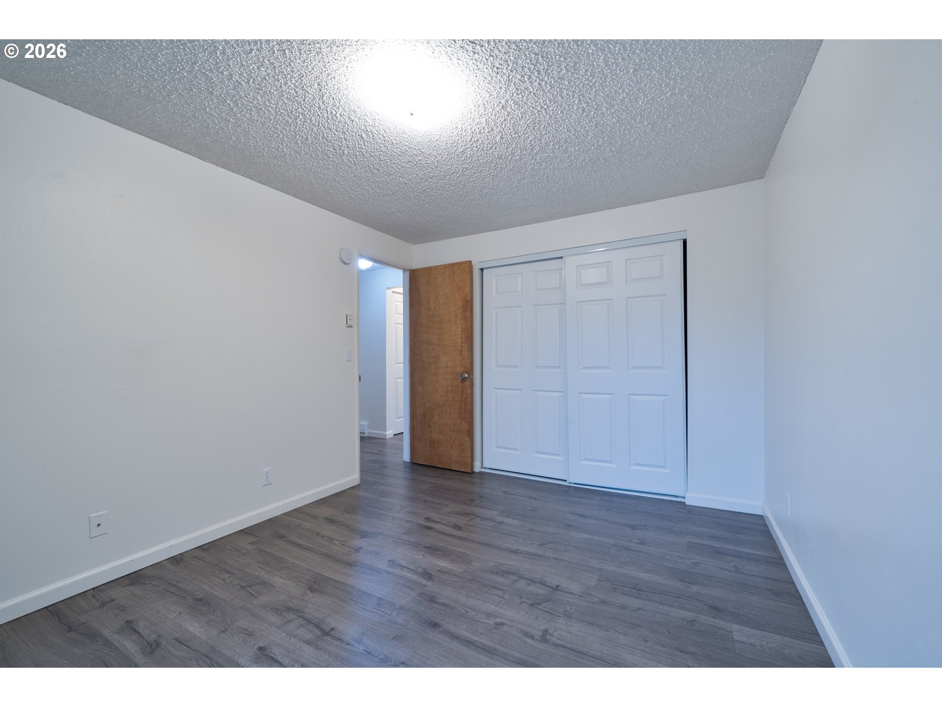 5514 3rd Street Tillamook, OR 97141 - Photo 13 of 25 a view of an empty room with wooden floor
