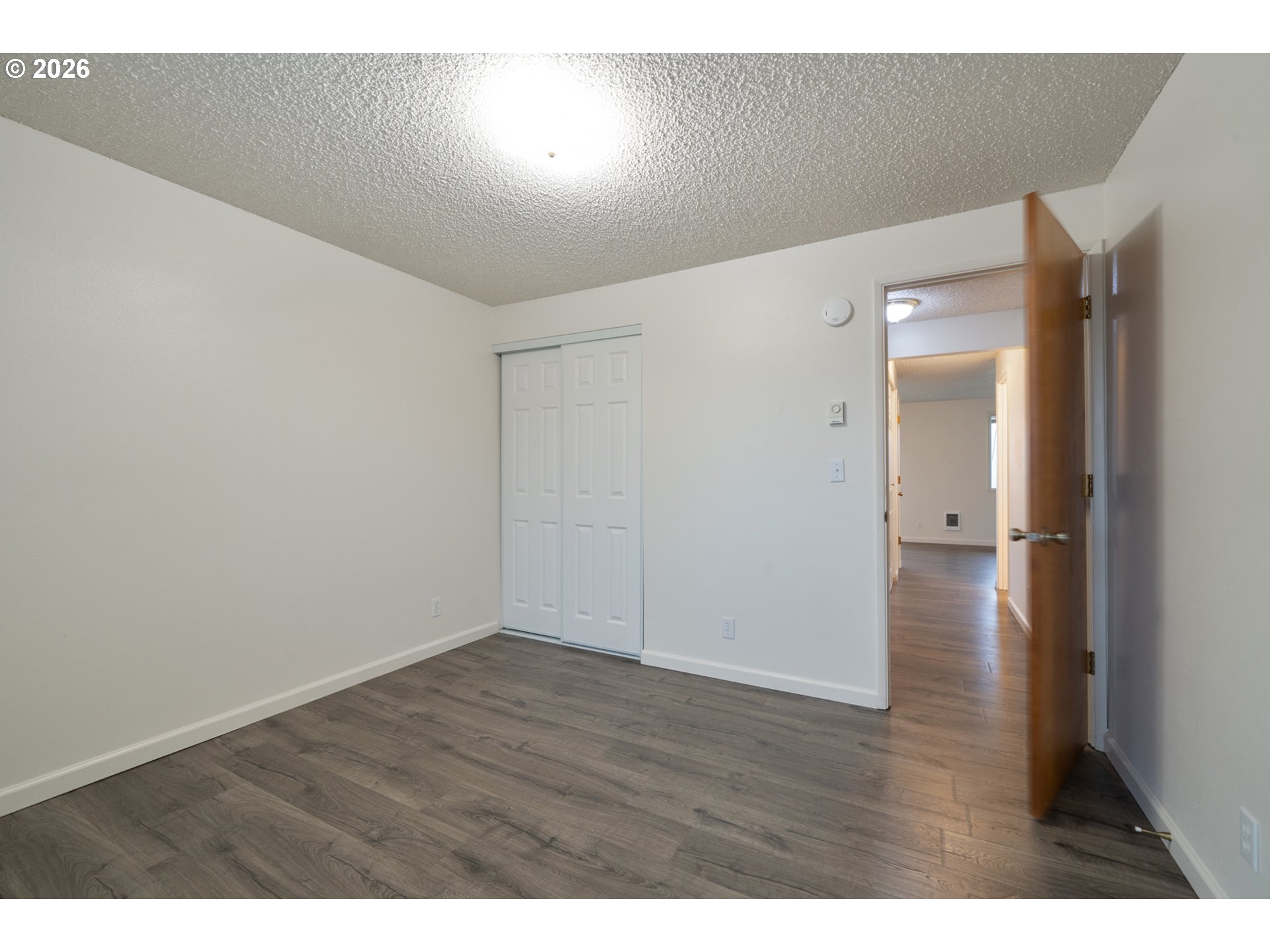 5514 3rd Street Tillamook, OR 97141 - Photo 17 of 25 a view of an empty room with wooden floor