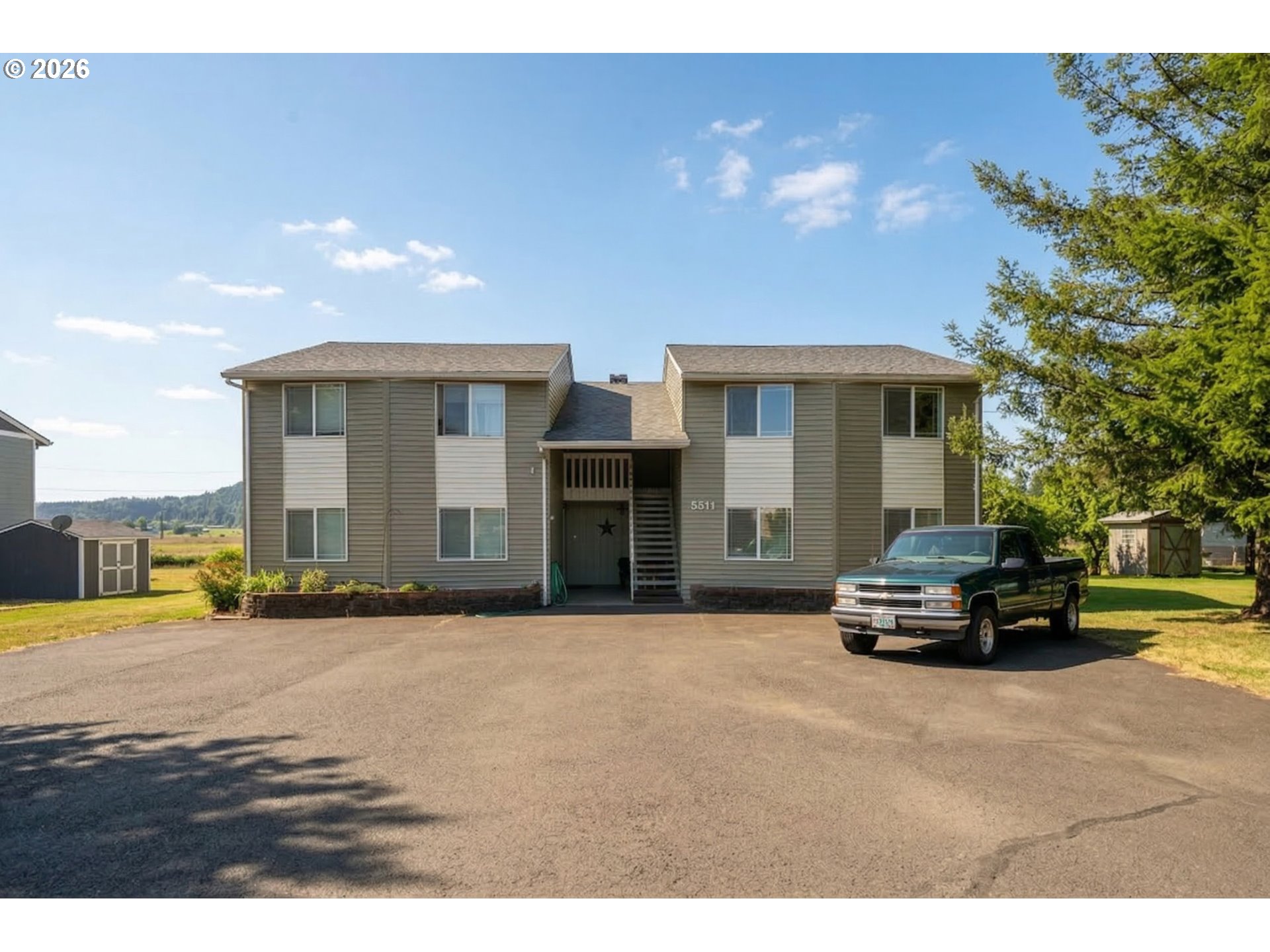 5514 3rd Street Tillamook, OR 97141 - Photo 25 of 25 a car parked in front of yellow house
