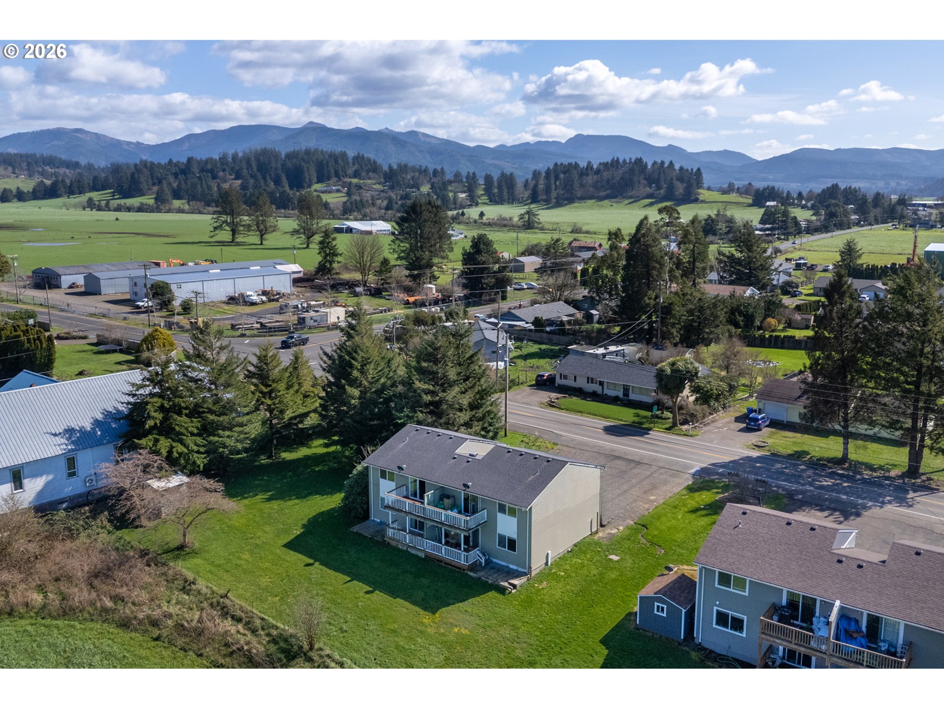 5514 3rd Street Tillamook, OR 97141 - Photo 6 of 25 a view of a city with mountains in the background