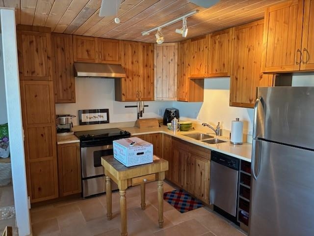 49594 KE Road Mesa, CO 81643 - Photo 15 of 19 a kitchen with a refrigerator a stove a sink and a cabinets