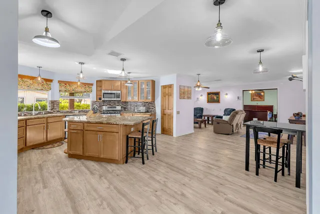 a view of a livingroom with workspace and a window