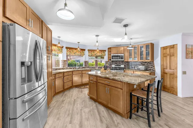 a view of a livingroom with furniture and a window