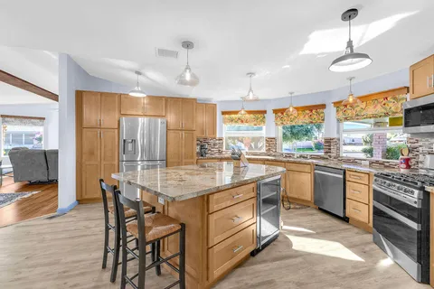 a view of a dining room with furniture window and outside view