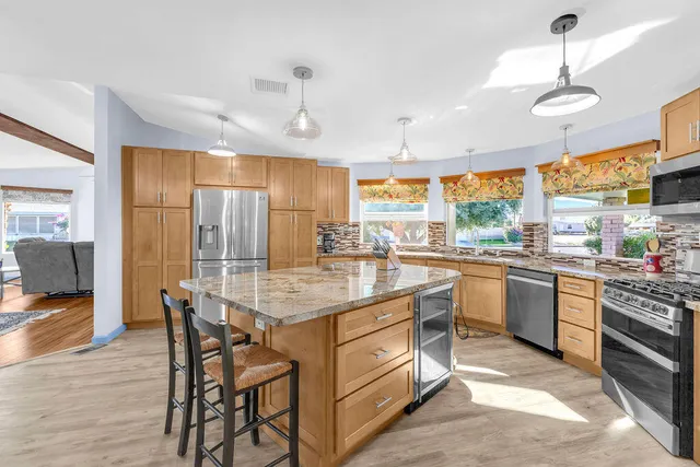 a view of a dining room with furniture window and outside view