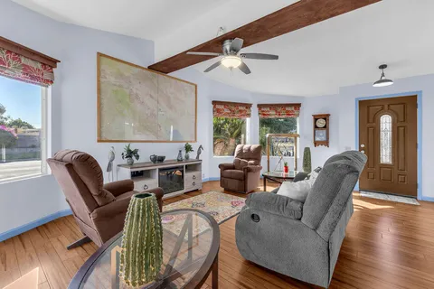 a living room with furniture and a large window