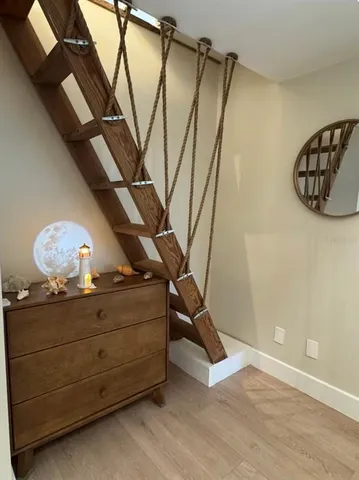 a view of a room with rack and wooden floor