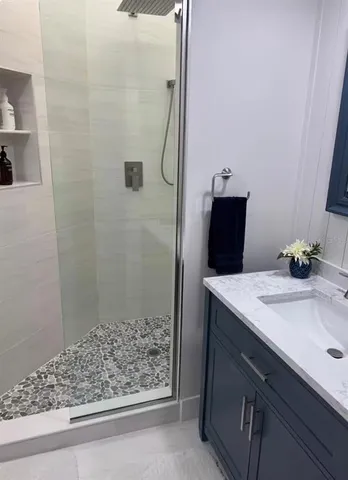 a bathroom with a toilet and a shower