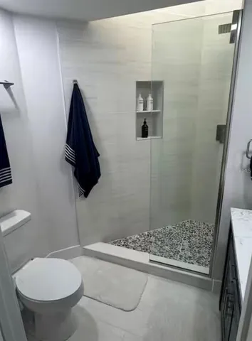 a view of a kitchen with washer and dryer