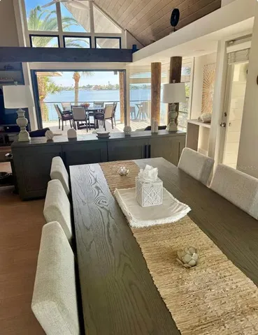 a living room with large window and furniture