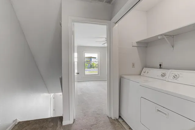a view of storage and utility room with washer and dryer