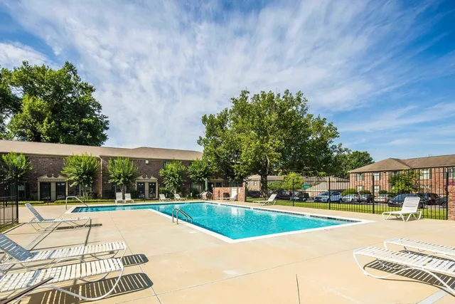 a view of a swimming pool with a patio