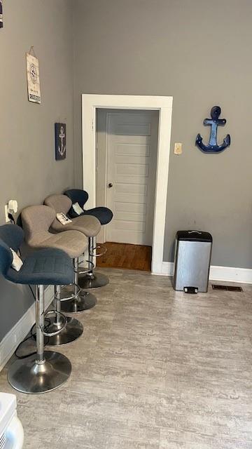 202 Veazey Street Union Point, GA 30669 - Photo 11 of 57 a room with furniture and wooden floor