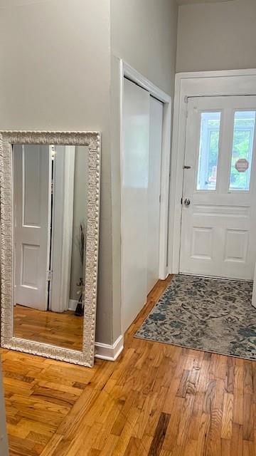 202 Veazey Street Union Point, GA 30669 - Photo 13 of 57 a view of a livingroom with wooden floor and a bathroom