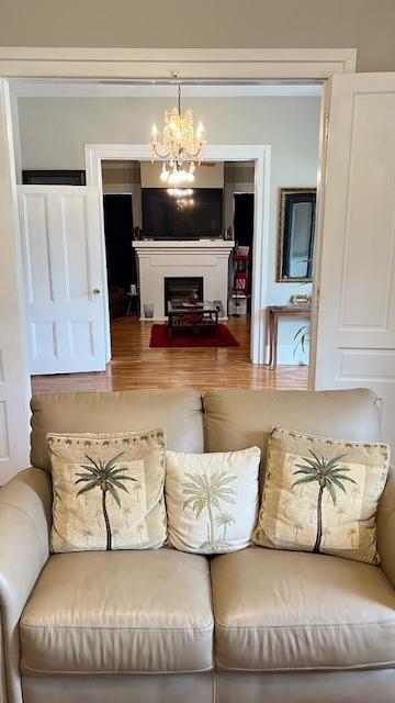 202 Veazey Street Union Point, GA 30669 - Photo 24 of 57 a living room with furniture and a chandelier