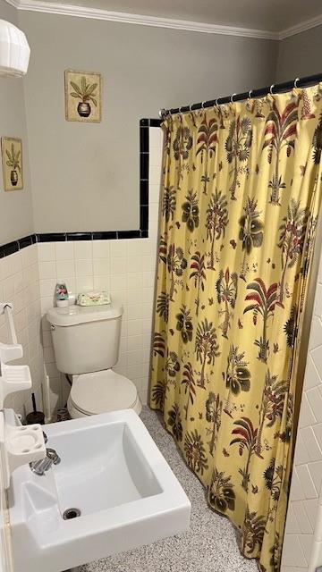 202 Veazey Street Union Point, GA 30669 - Photo 32 of 57 a bathroom with a toilet and a sink