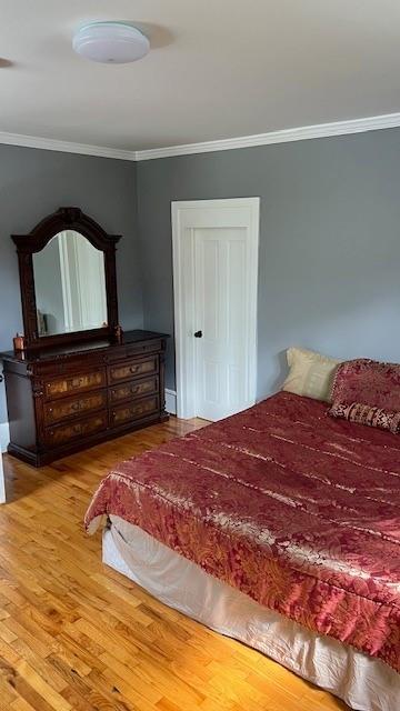202 Veazey Street Union Point, GA 30669 - Photo 39 of 57 a bedroom with a bed and dresser with mirror