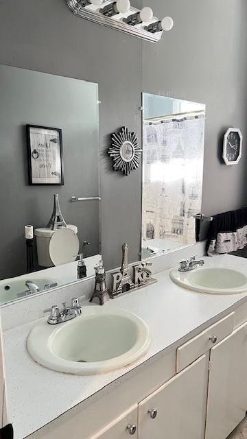 202 Veazey Street Union Point, GA 30669 - Photo 42 of 57 a bathroom with a sink and a mirror