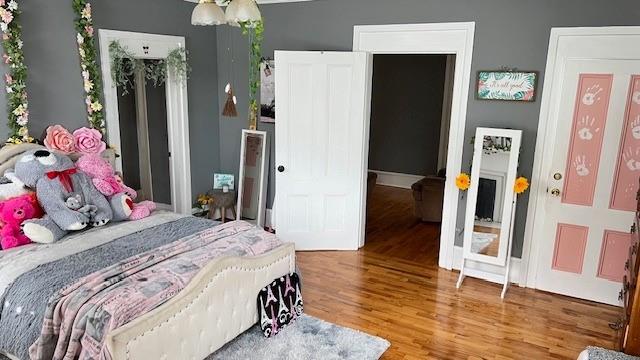 202 Veazey Street Union Point, GA 30669 - Photo 46 of 57 a bedroom with a bed and wooden floor