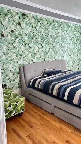 an aerial view of a house with swimming pool and garden