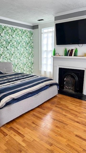 202 Veazey Street Union Point, GA 30669 - Photo 49 of 57 a living room with a fireplace a flat screen tv and a floor to ceiling window
