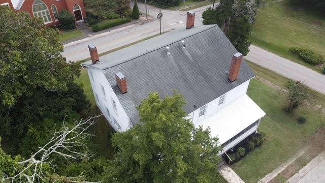 202 Veazey Street Union Point, GA 30669 - Photo 5 of 57 an aerial view of a house with a yard and a fountain