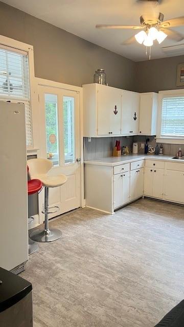 202 Veazey Street Union Point, GA 30669 - Photo 10 of 57 a kitchen with granite countertop a stove a sink and a refrigerator