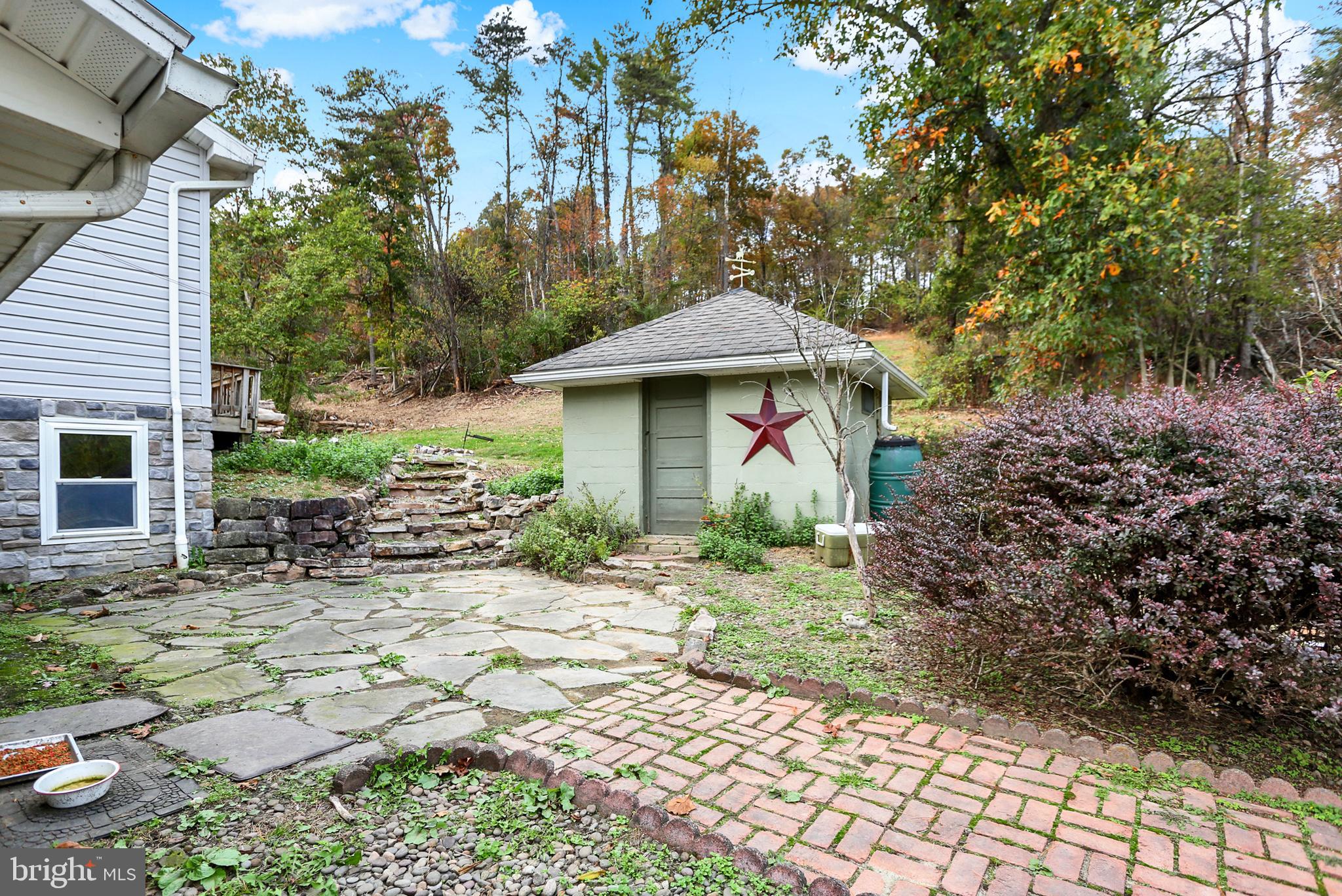 64 Metz Road Thompsontown, PA 17094 - Photo 13 of 59 a front view of a house with garden
