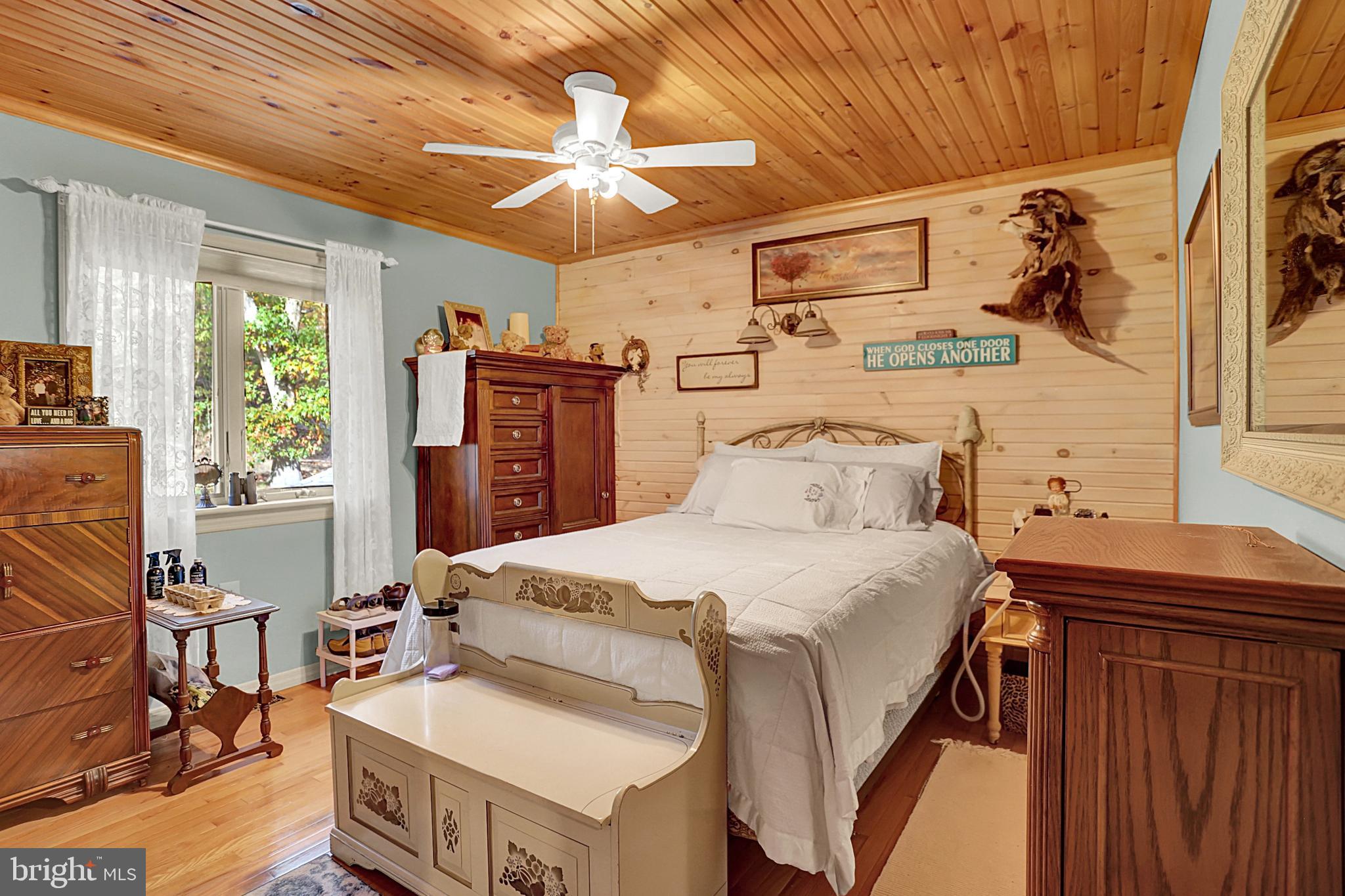 64 Metz Road Thompsontown, PA 17094 - Photo 50 of 59 a bedroom with a bed and a chandelier