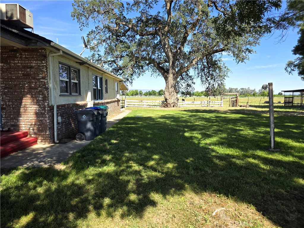 23773 River Road Corning, CA 96021 - Photo 27 of 64 a view of yard with swimming pool and green space