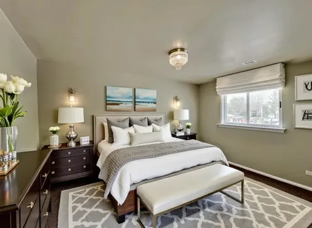 a bedroom with a bed and a lamp with window