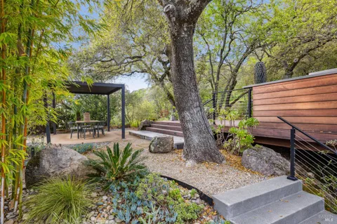 a kitchen with stainless steel appliances a refrigerator sink and stove