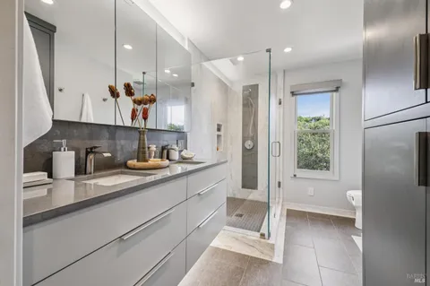 a building outdoor space with patio furniture and a potted plant