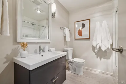 a view of a balcony with two chairs and a table