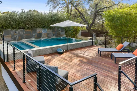 a view of a chairs and table on the wooden floor