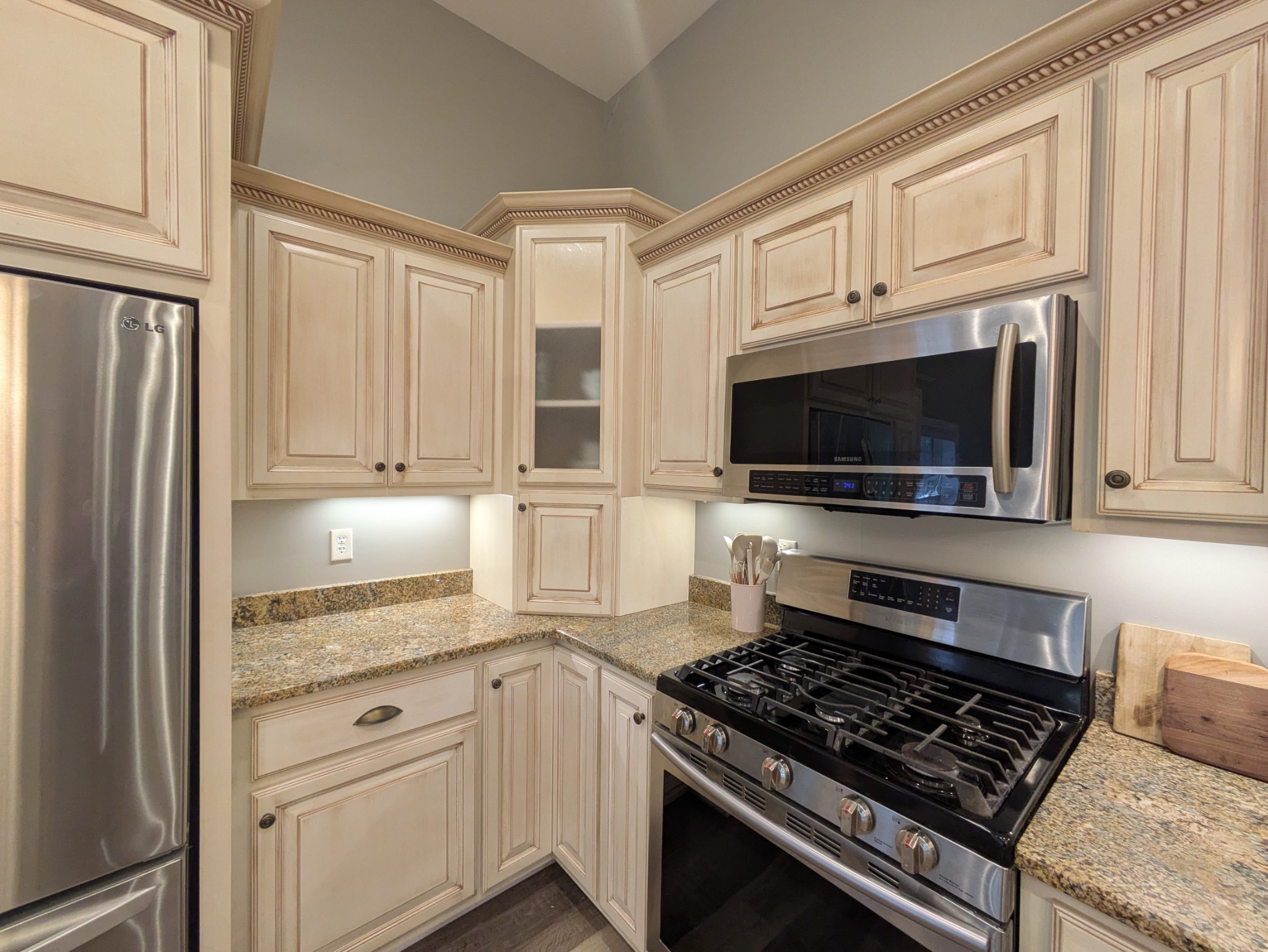 3425 Hopkins Bridge Road Unionville, TN 37180 - Photo 13 of 83 a kitchen with stainless steel appliances white cabinets and a stove top oven