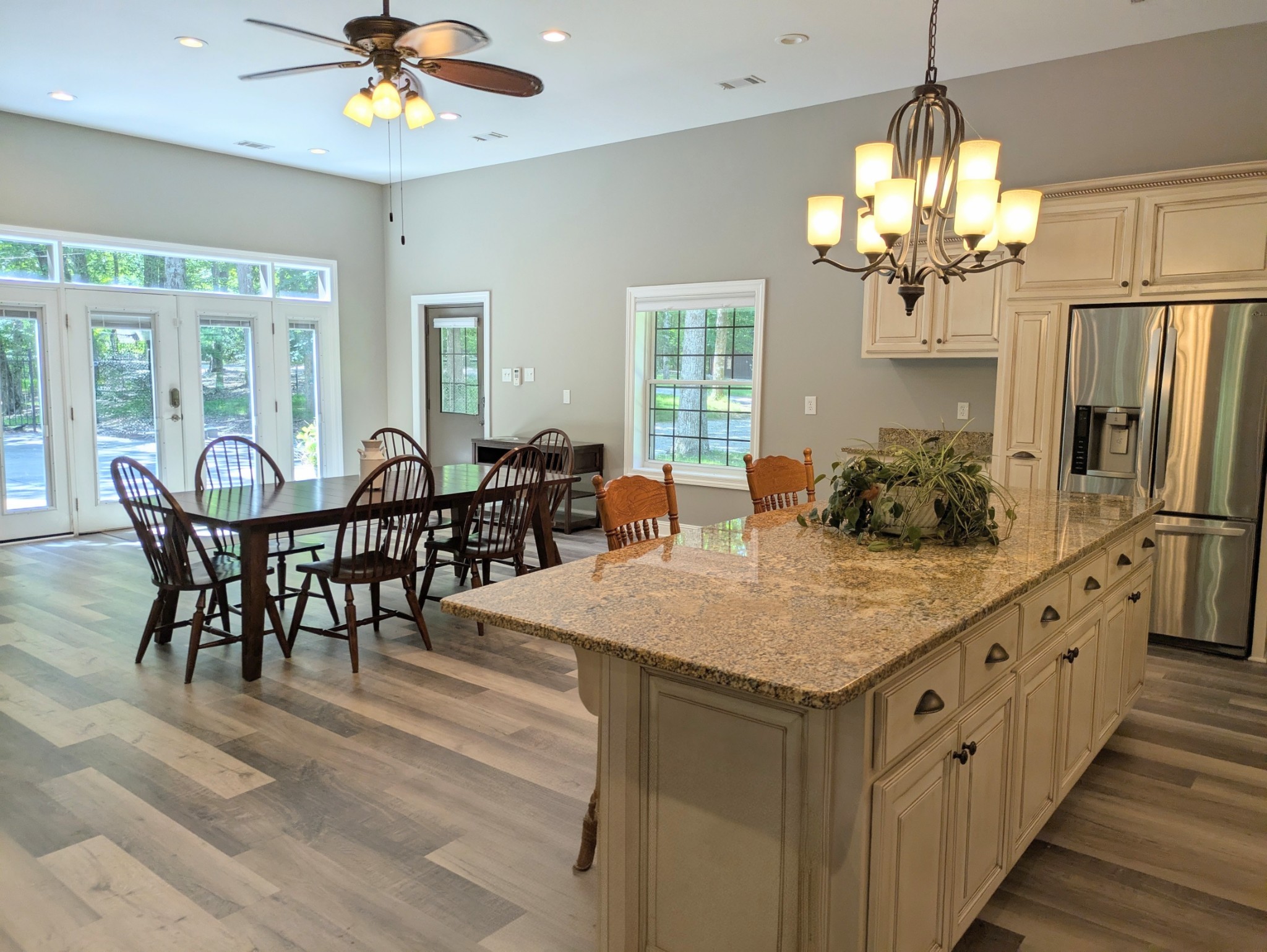 3425 Hopkins Bridge Road Unionville, TN 37180 - Photo 14 of 83 a view of a dining room with furniture a chandelier and wooden floor