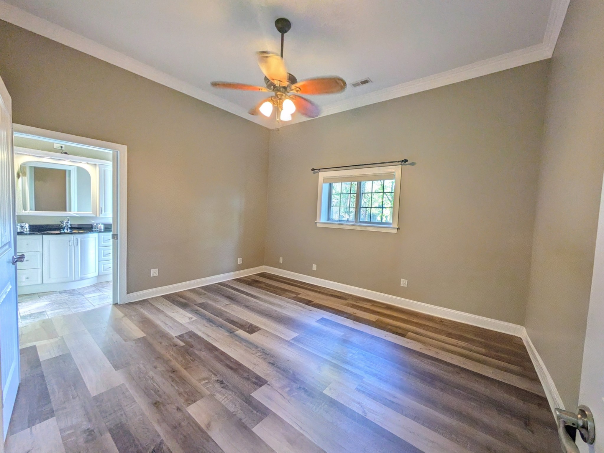 3425 Hopkins Bridge Road Unionville, TN 37180 - Photo 31 of 83 a view of an empty room with wooden floor and a window