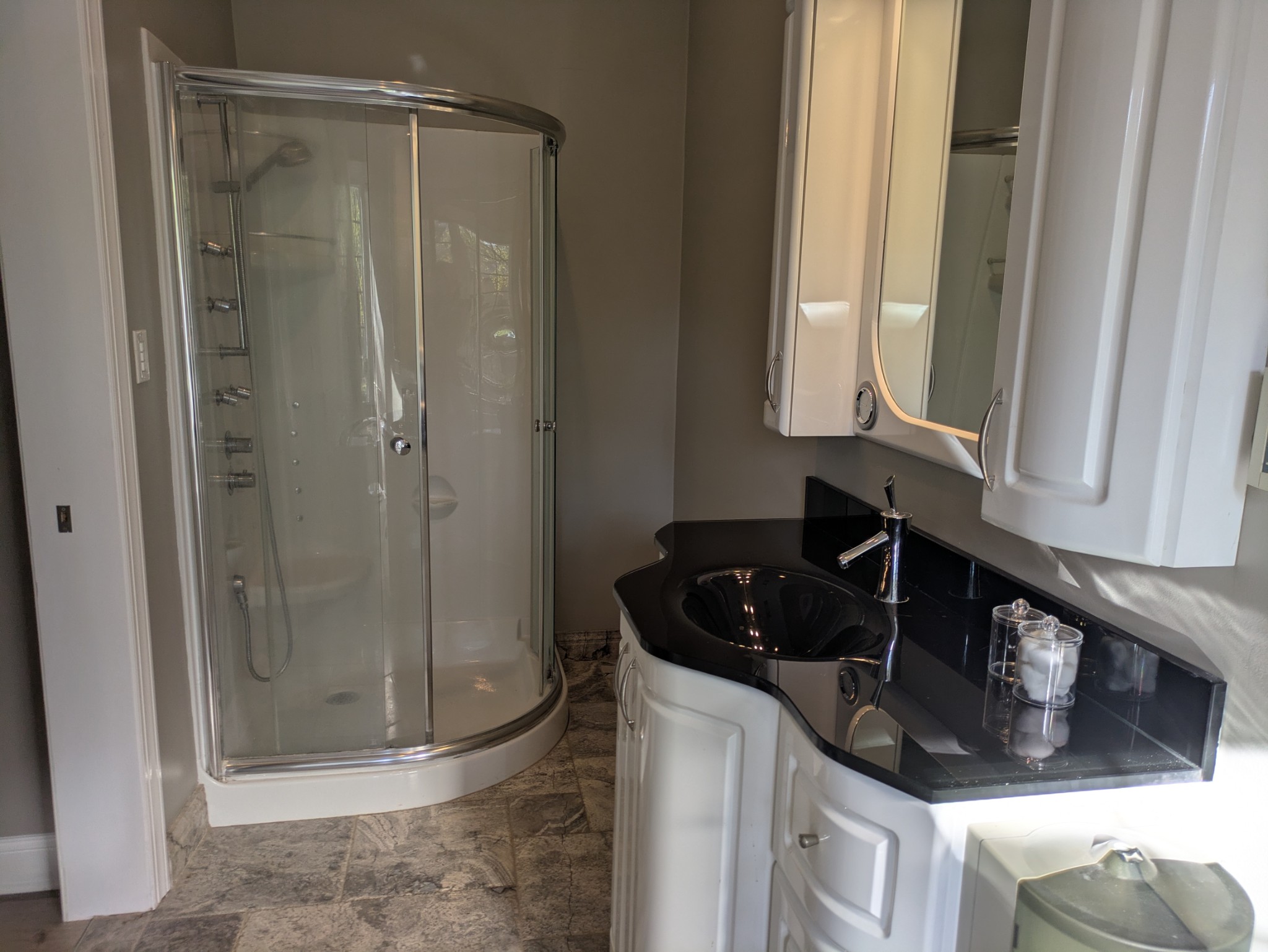 3425 Hopkins Bridge Road Unionville, TN 37180 - Photo 32 of 83 a bathroom with a granite countertop sink a mirror and shower