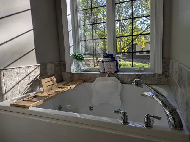 a wooden fence with trees in the background